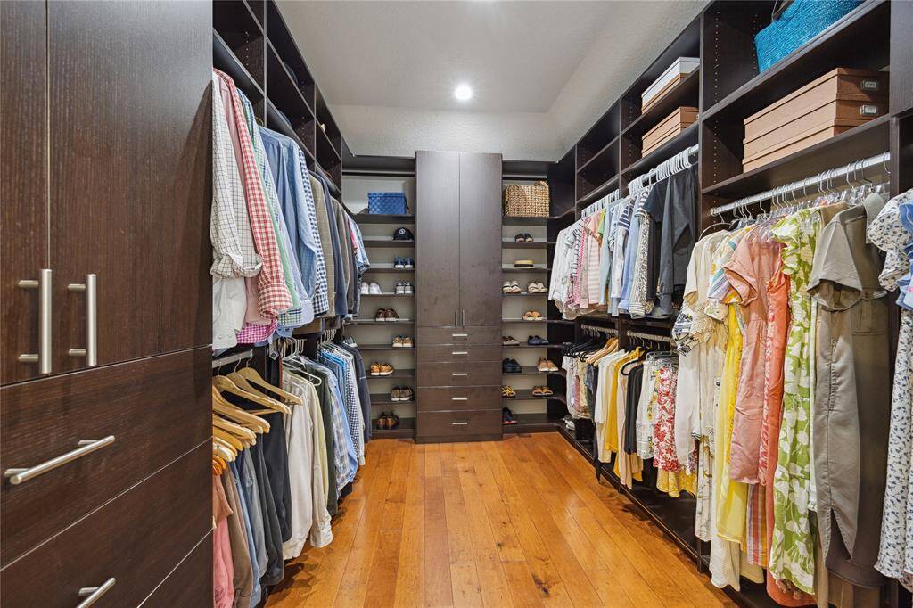 Customized by California Closets, this dream closet offers optimal storage and organization.