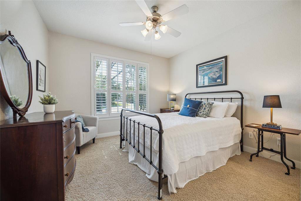 A large window overlooks the front yard while plantation shutters allow you to adjust the level of privacy.