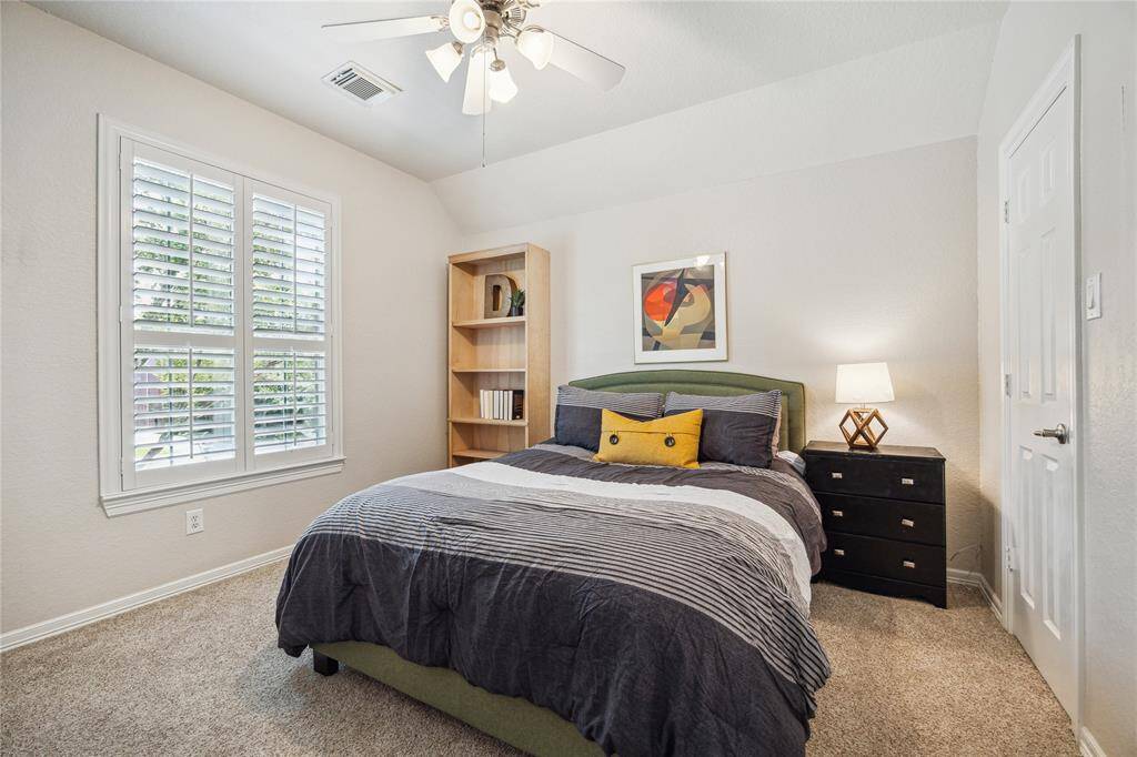 This first of 3 upstairs bedrooms is at the front of the home near the bathroom.