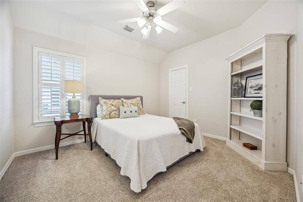 On the other side of the upstairs are two more bedrooms. This room shares a Hollywood bathroom with another bedroom.