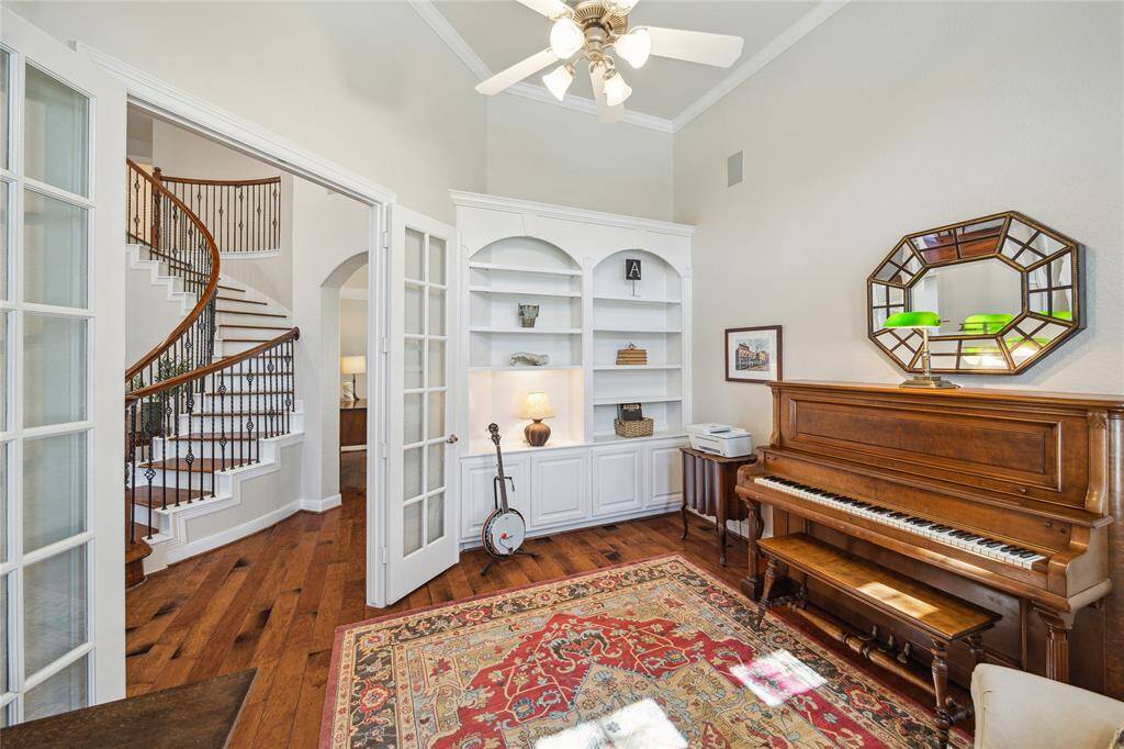 To the right of the foyer, wood flooring continues into the private study.