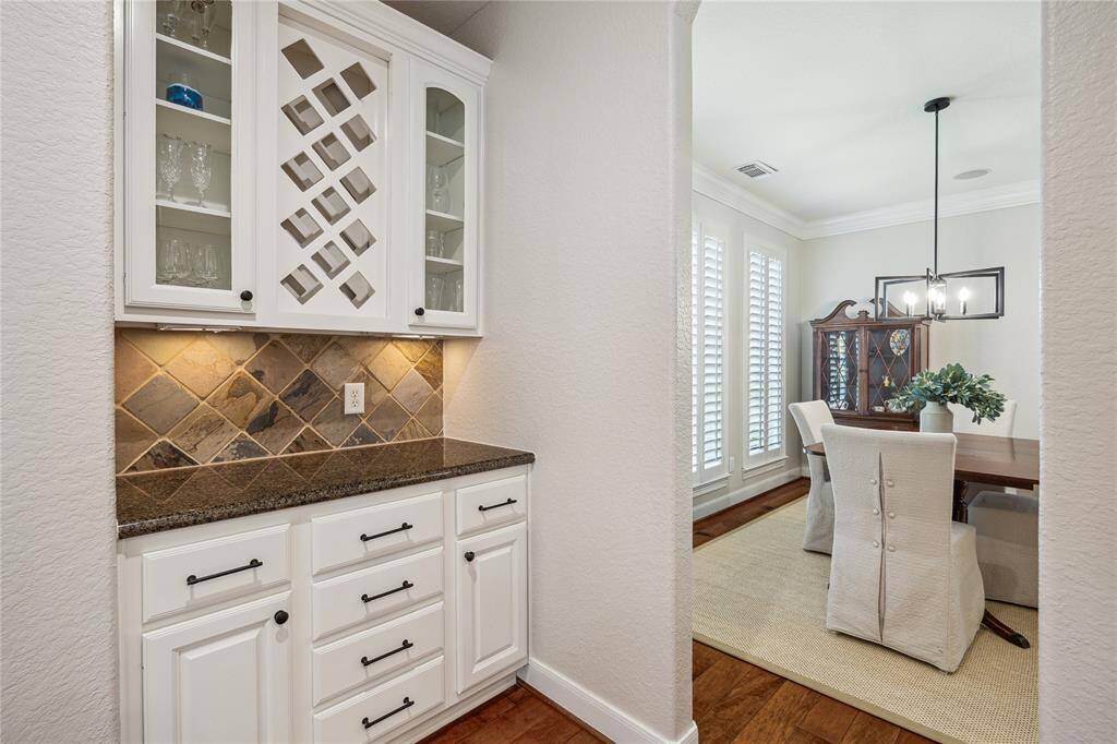 The butler’s pantry offers a seamless connection between the kitchen and dining area, perfect for effortless entertaining and serving.