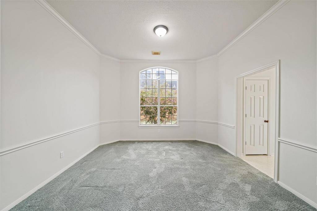 Spacious Family Room features carpet flooring, relaxing outside view and an ensuite bathroom.