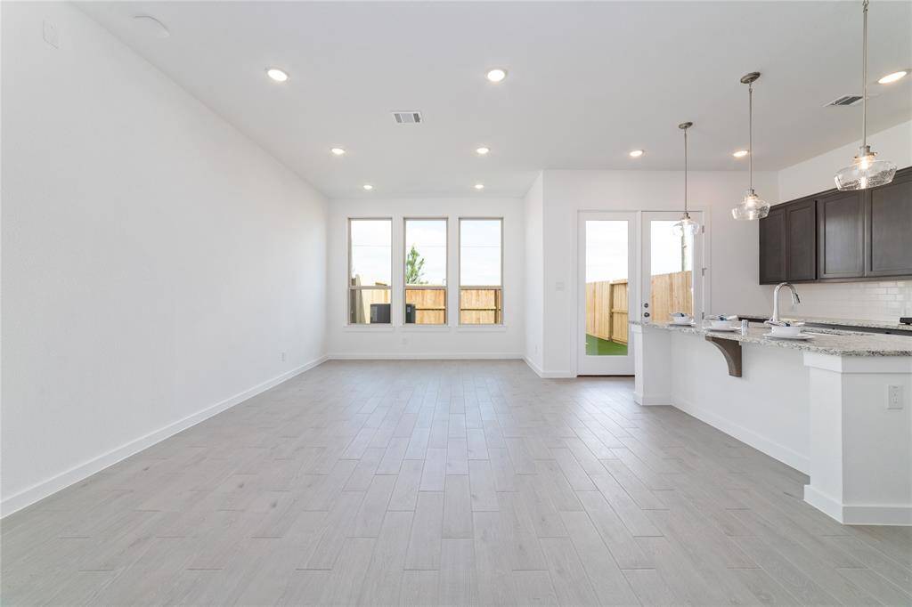 Lots of natural light from the back windows and patio