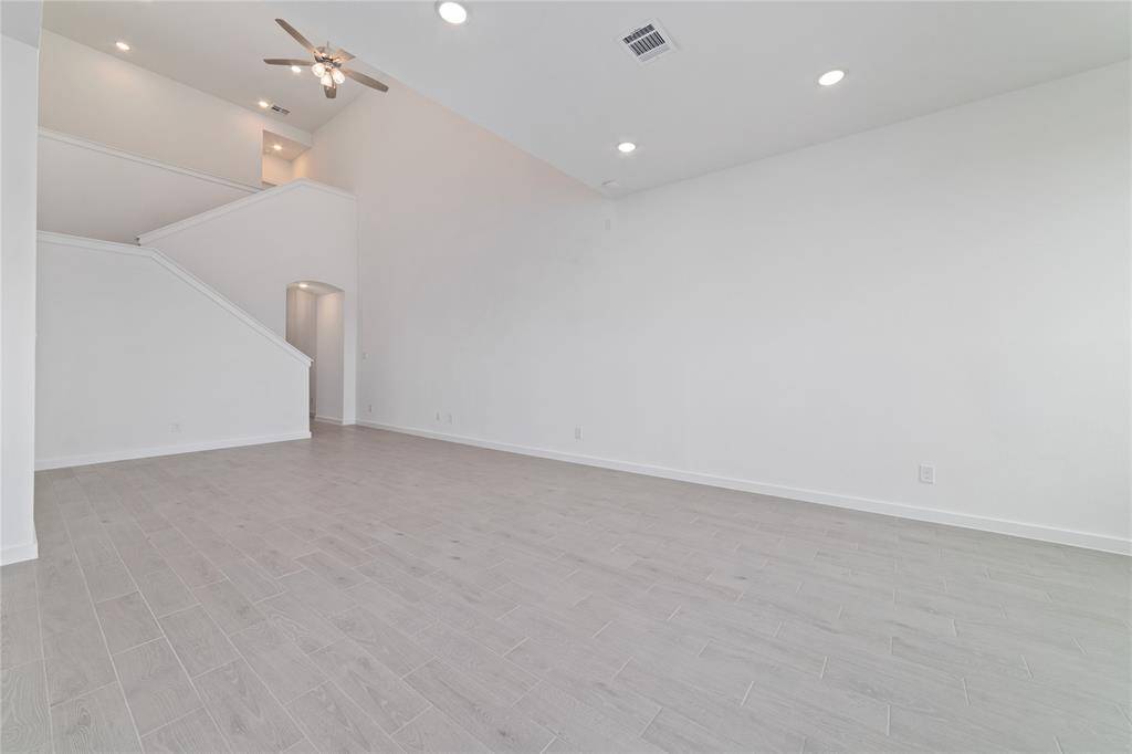 Expansive main floor with durable wood-like tile throughout