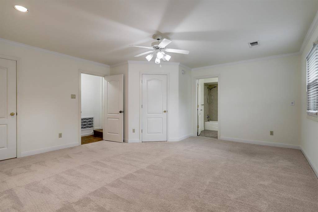 The largest of the upstairs secondary bedrooms with 2 walk-in closets and a full en-suite bathroom.