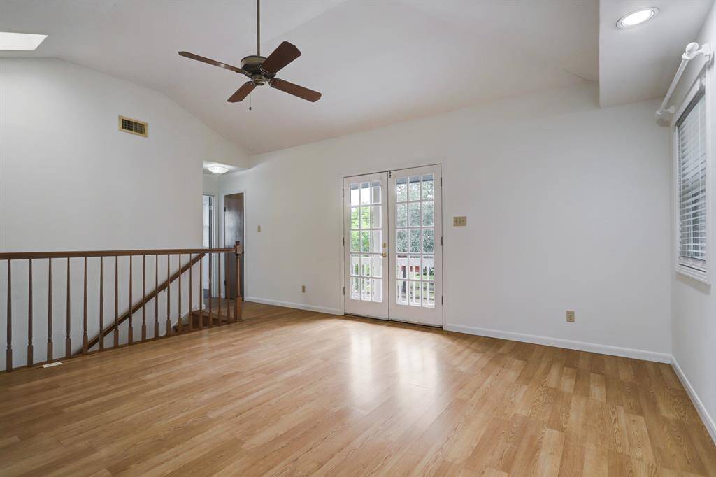 Upstairs primary suite off of front stairway of home. Large room with double french glass doors leading to priivate balcony facing Brompton.