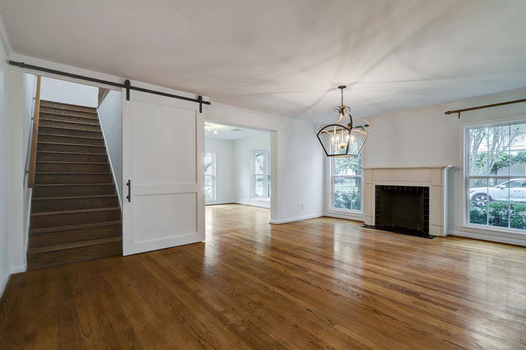 Another view of the dining room and of of stairs leading to primary suite.