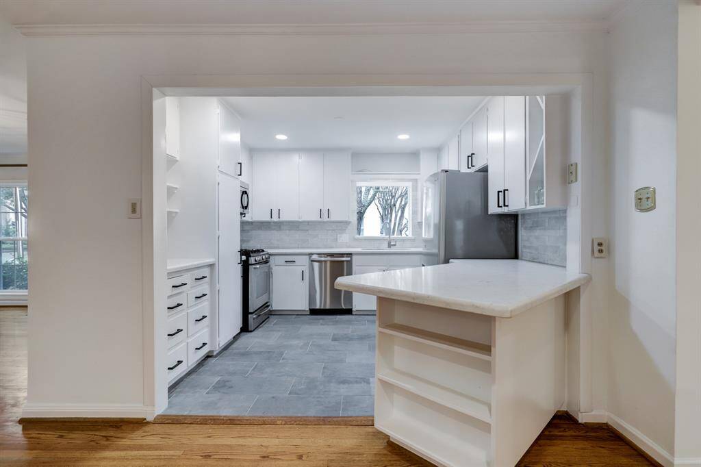 Kitchen as seen from the den and breakfast area. Quartz counter can accommodate kitchen counter seating.