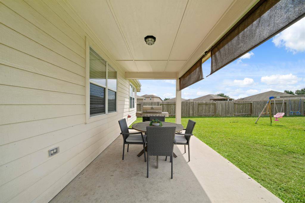 Large Rear Covered Porch to Enjoy Entertaining Guests.