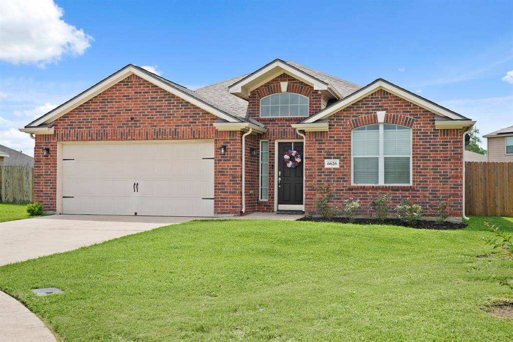 This Home Offers Beautiful Curb Appeal including Manicured Landscaping.