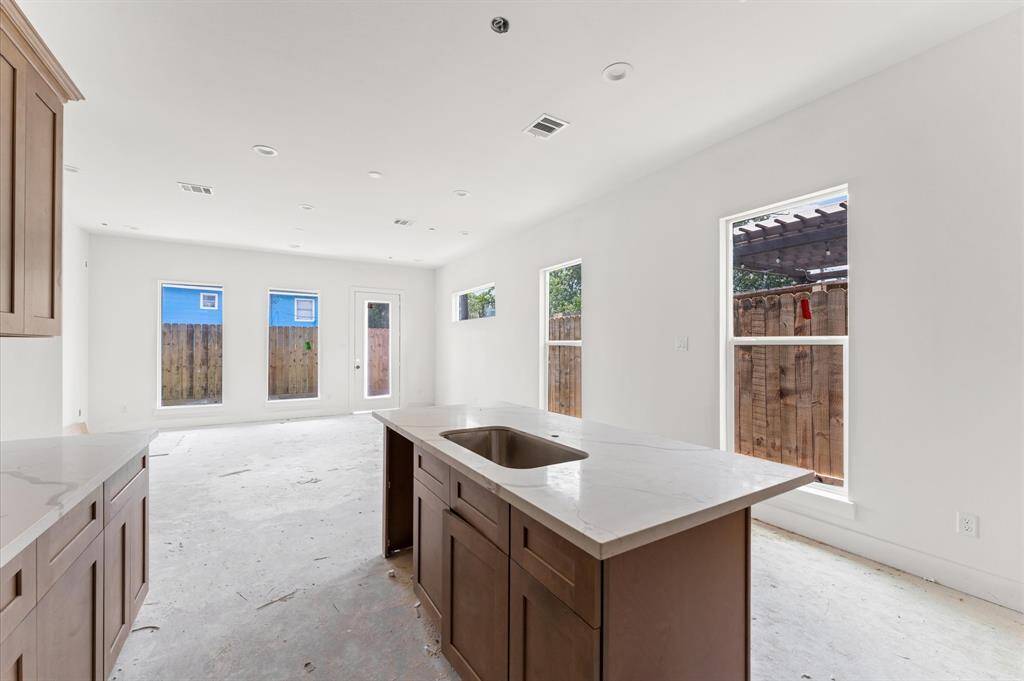 Ample natural light in the kitchen and living area. *Photos taken in early June*
