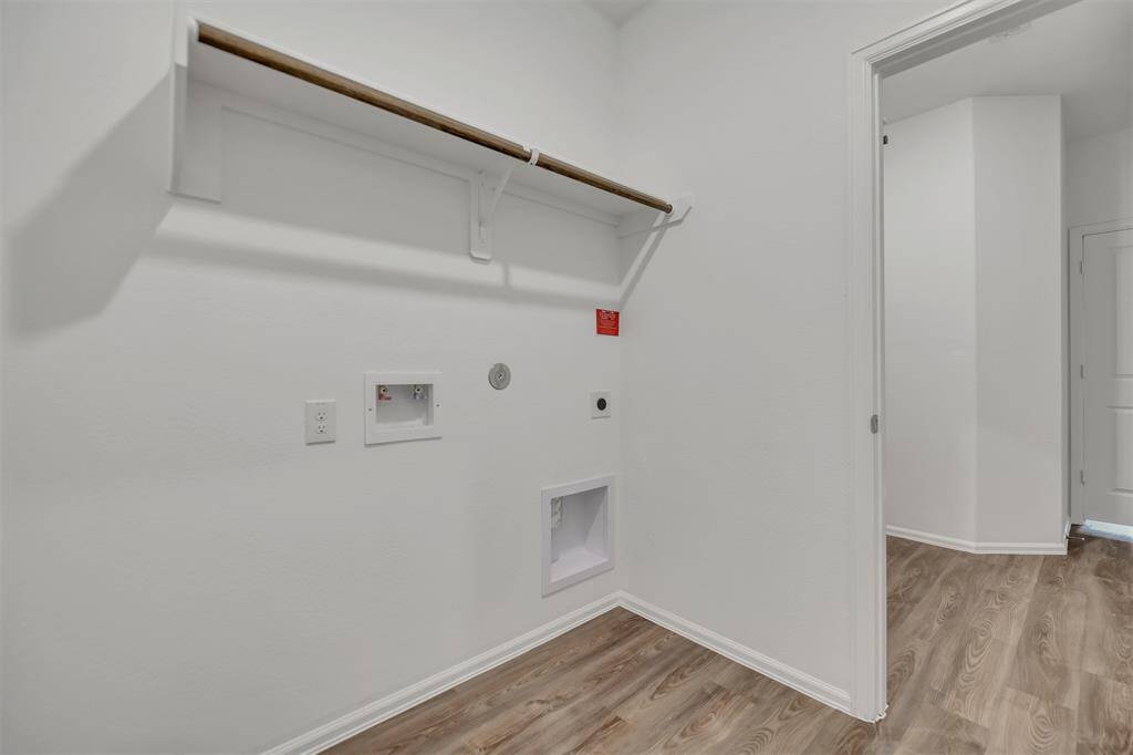 The utility room is perfectly places between the secondary bedrooms and primary bedroom!  Great design!