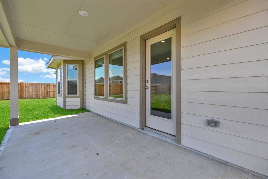 Covered back porch that will be enjoyed for sure!