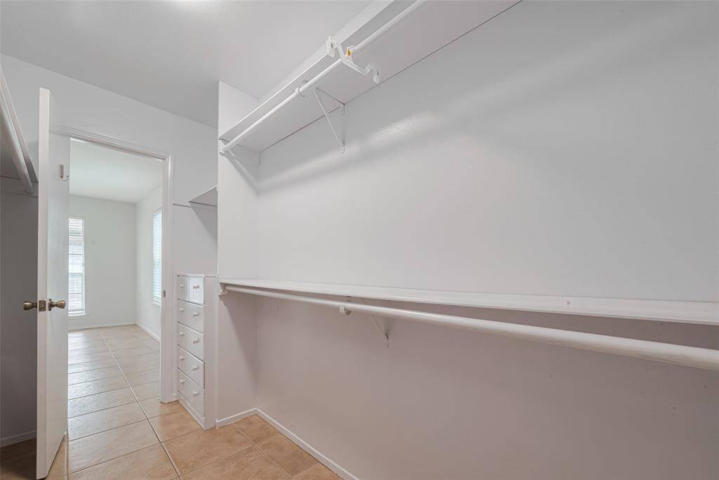 An additional picture of the abundance of space in the Walk in Closet.