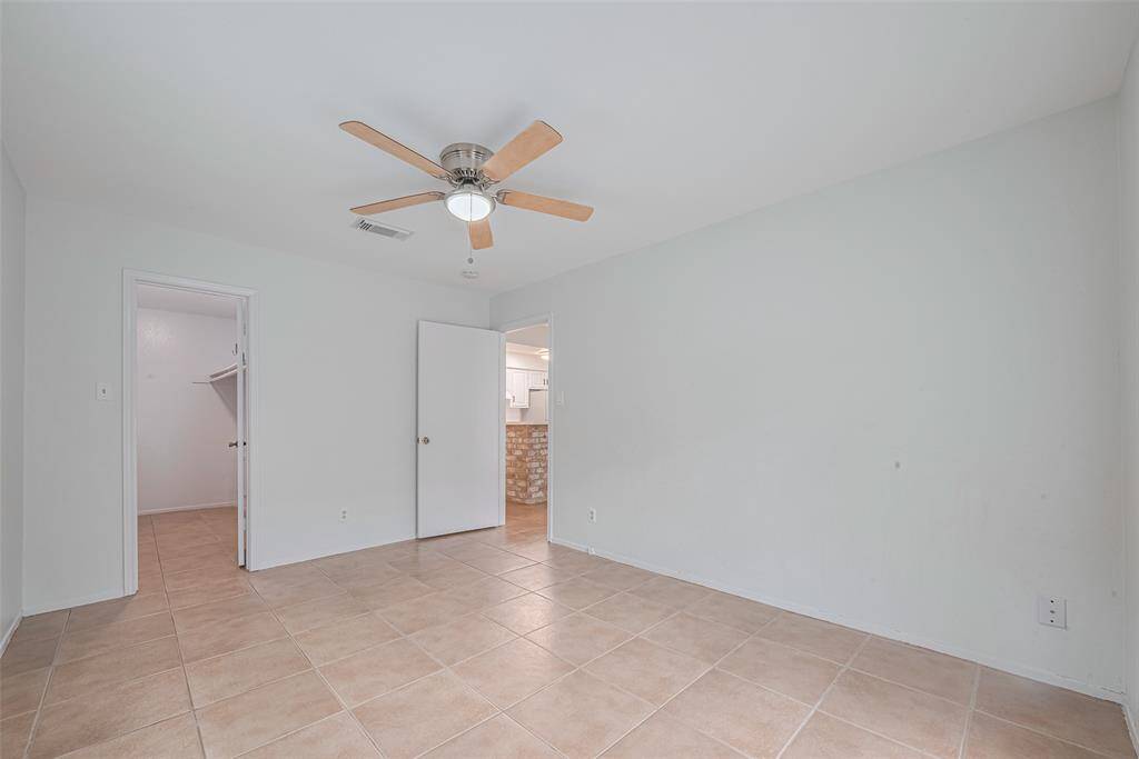 The roomy bedroom opens into the walk in closet, the bath and the living area.