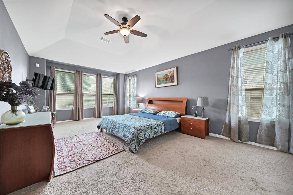 Spacious and private downstairs master suite with back yard view.