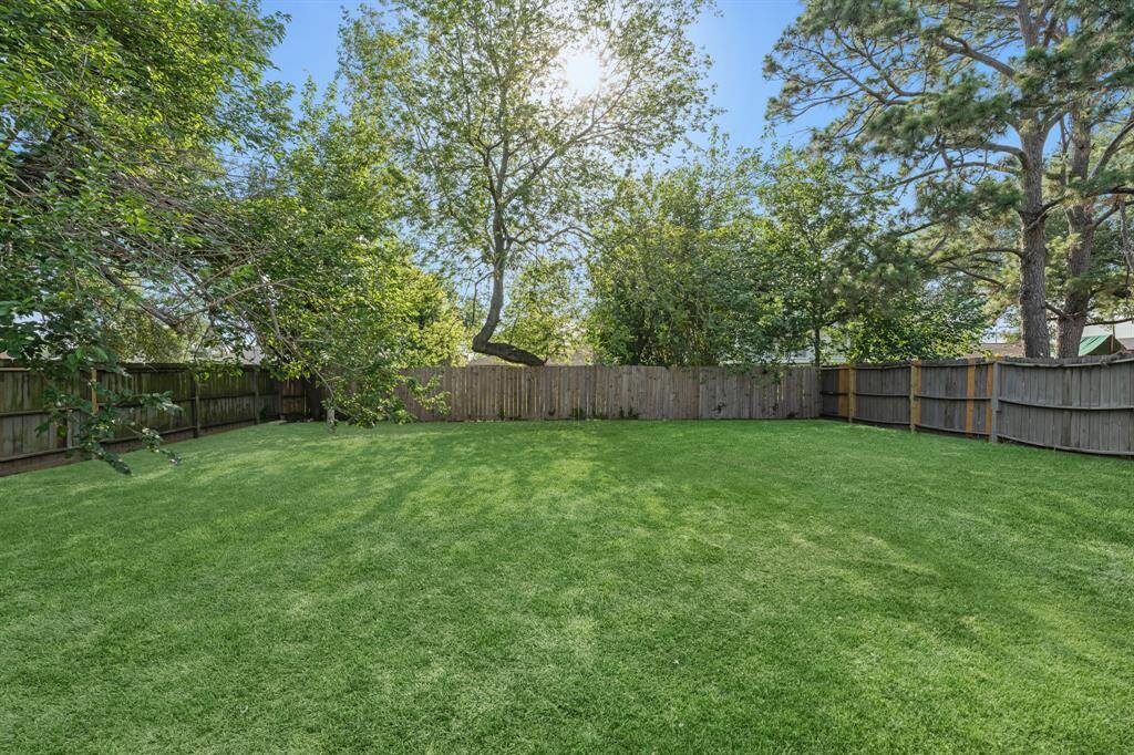 This backyard is perfect for family gatherings, social events, or simply unwinding in the fresh air.