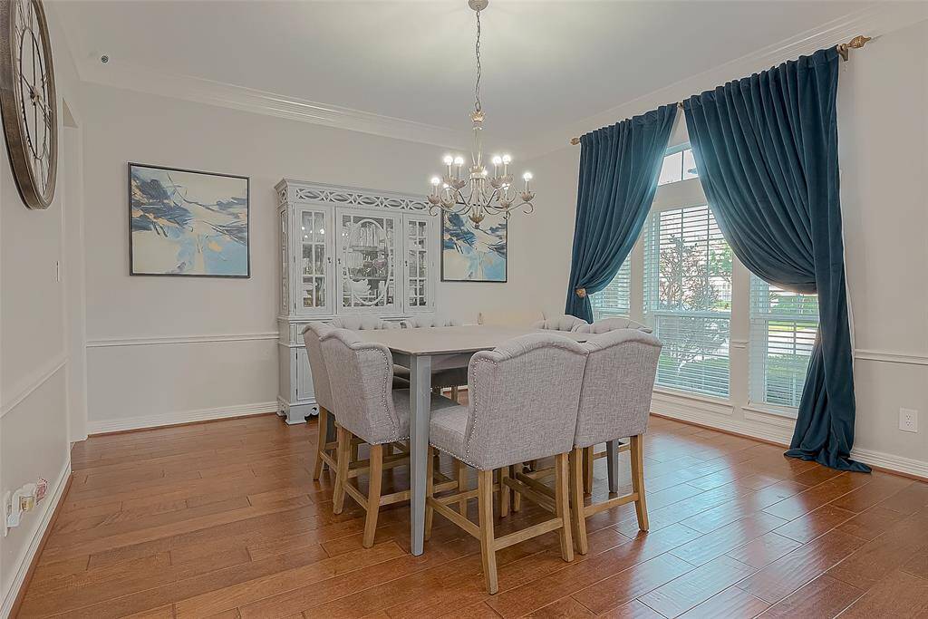 Formal Dining with hardwood flooring