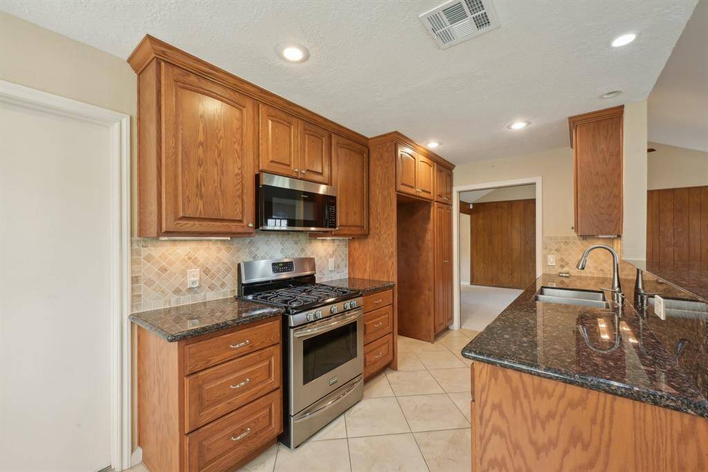 Pots and pans drawers are a great feature. Kitchen is open to family room and dining room keeping it light and bright.