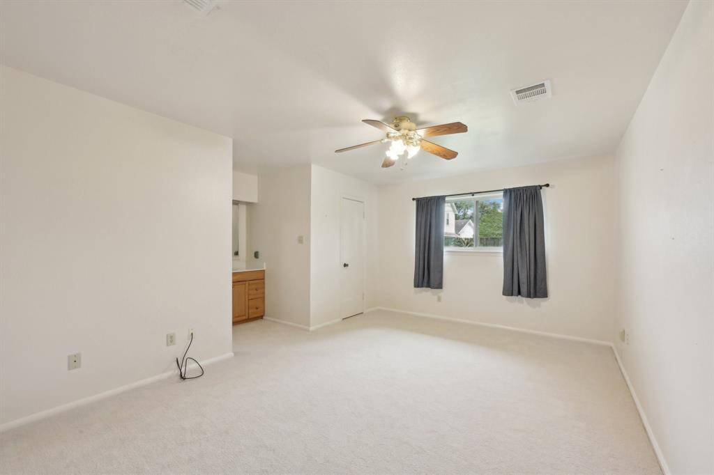 Primary bedroom is very spacious and has a walk-in closet. You'll love the new, plush carpet.