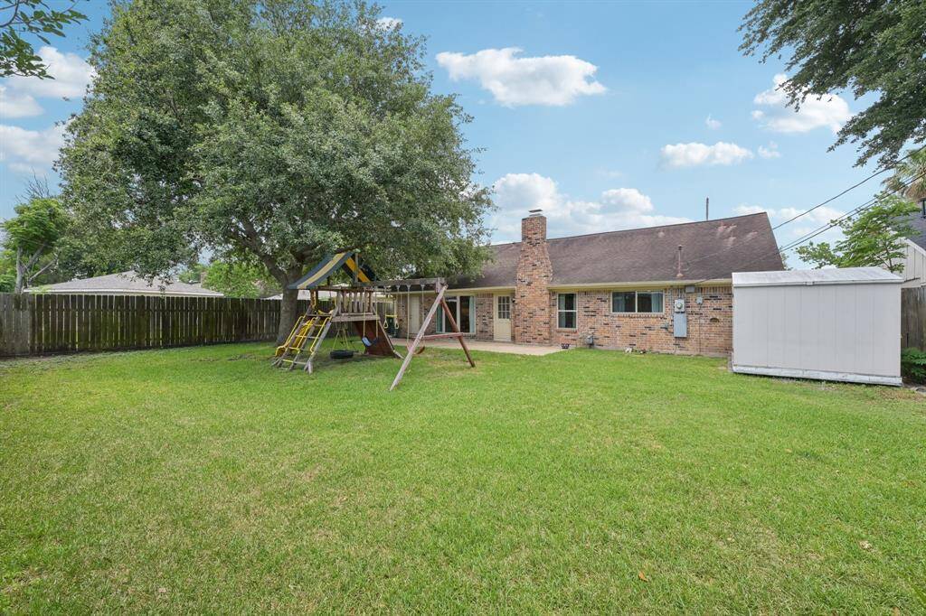 Large, well-trimmed tree offers great shade over patio area.