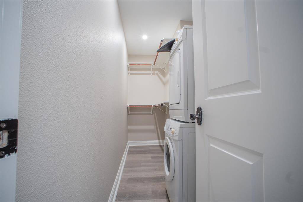 Washer & dryer in walk in closet.