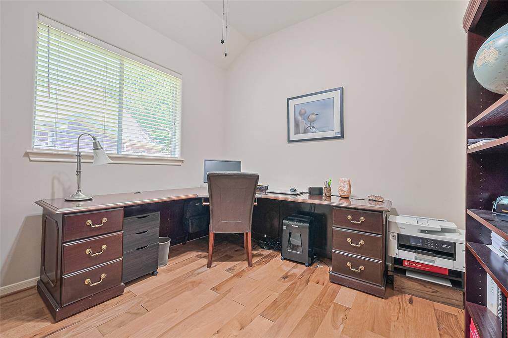 Optional bedroom or office with a closet. Desk and book cases part of furnishing.