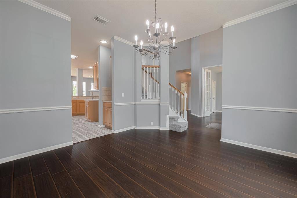 Formal Dining Room into Foyer and Kitchen