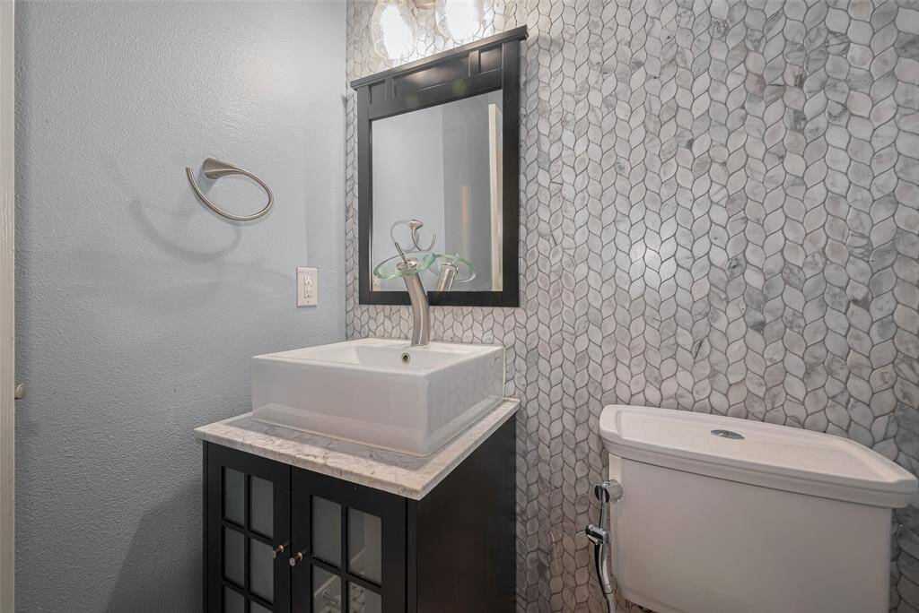 Half Bath on First Floor, next to Utility Room