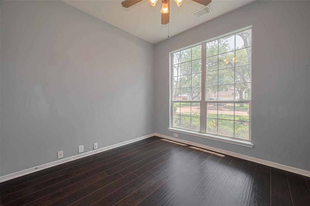 Second Bedroom on First Floor, in front of Half Bath of the same hallway