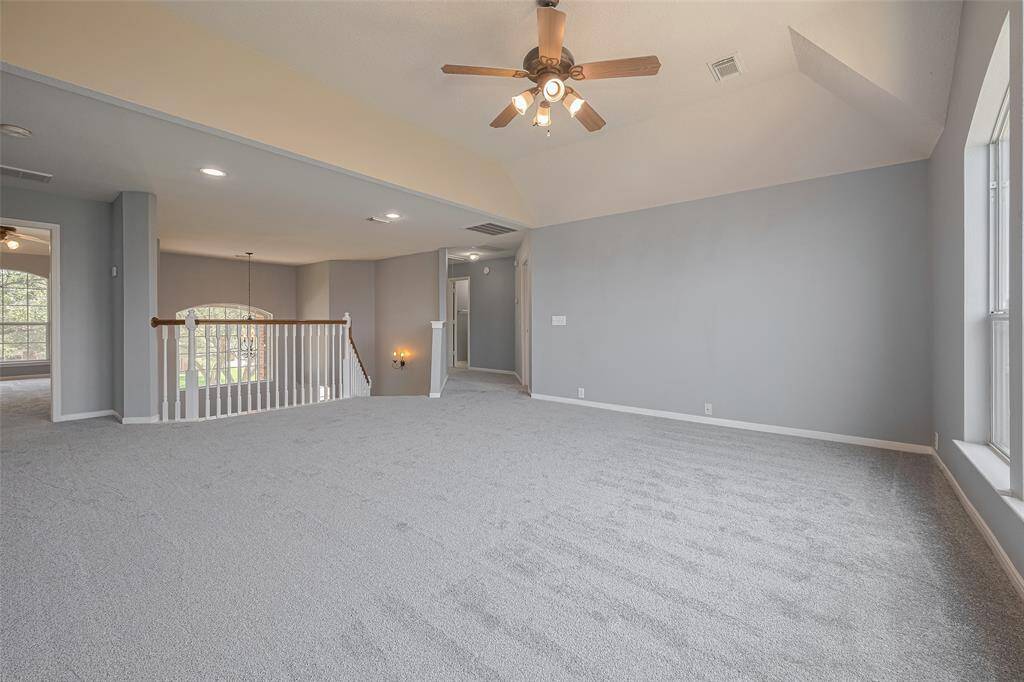 Game Room, from this POV, hallway on right leads to Third Bedroom, Second Full Bath, and the Den. Doors on left are Fourth and Fifth Bedrooms connected by Jack and Jill Bathroom.