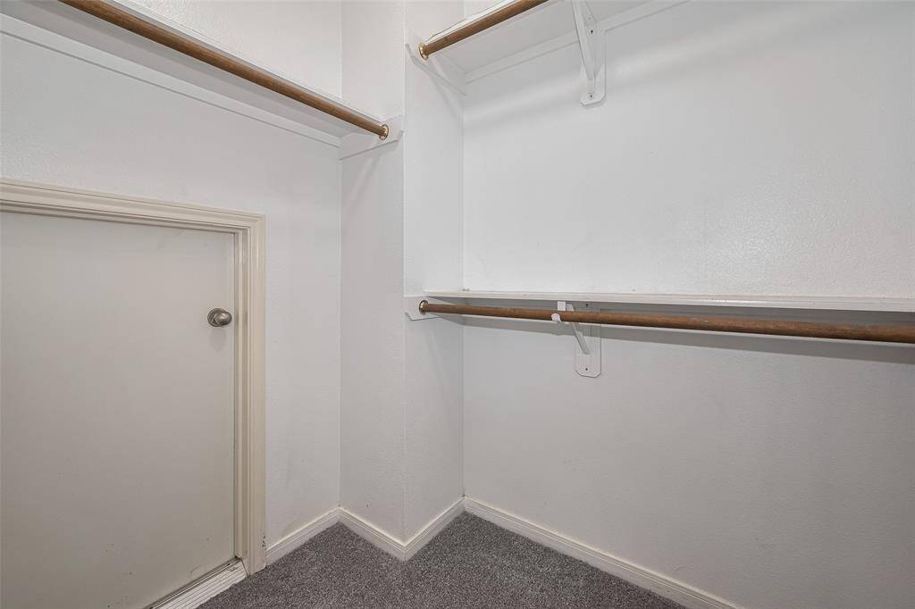 Fifth Bedroom's Closet with access to Attic and Water Heaters