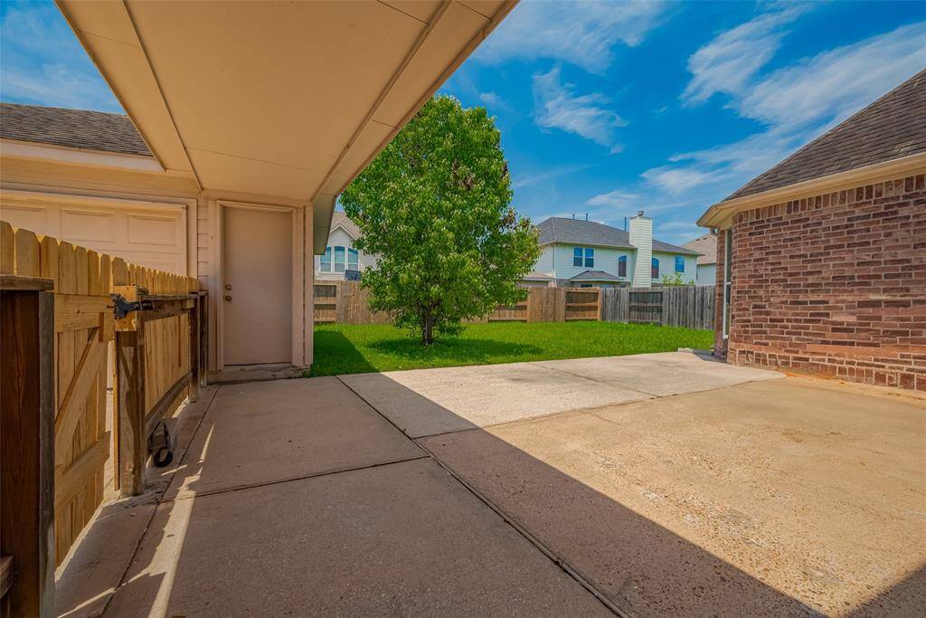 Backyard and door to Detached Garage