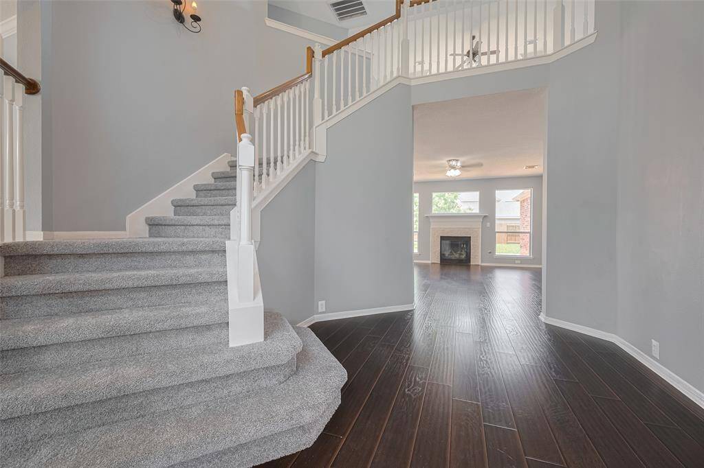 Foyer and Stairs leading into Family Room