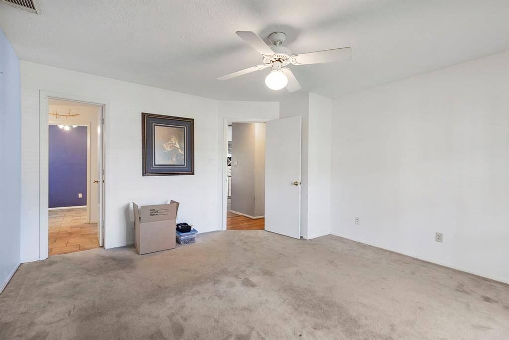 Primary bedroom is located on first floor split from secondary bedrooms for additional privacy.  It includes an on-suite bathroom with double sinks, garden tub and separate shower.  A walk in closet rounds out this area.
