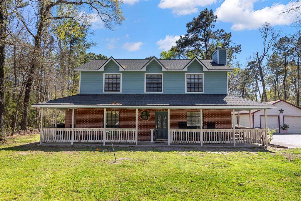Home features several covered patio areas, one on front porcch and back porch.