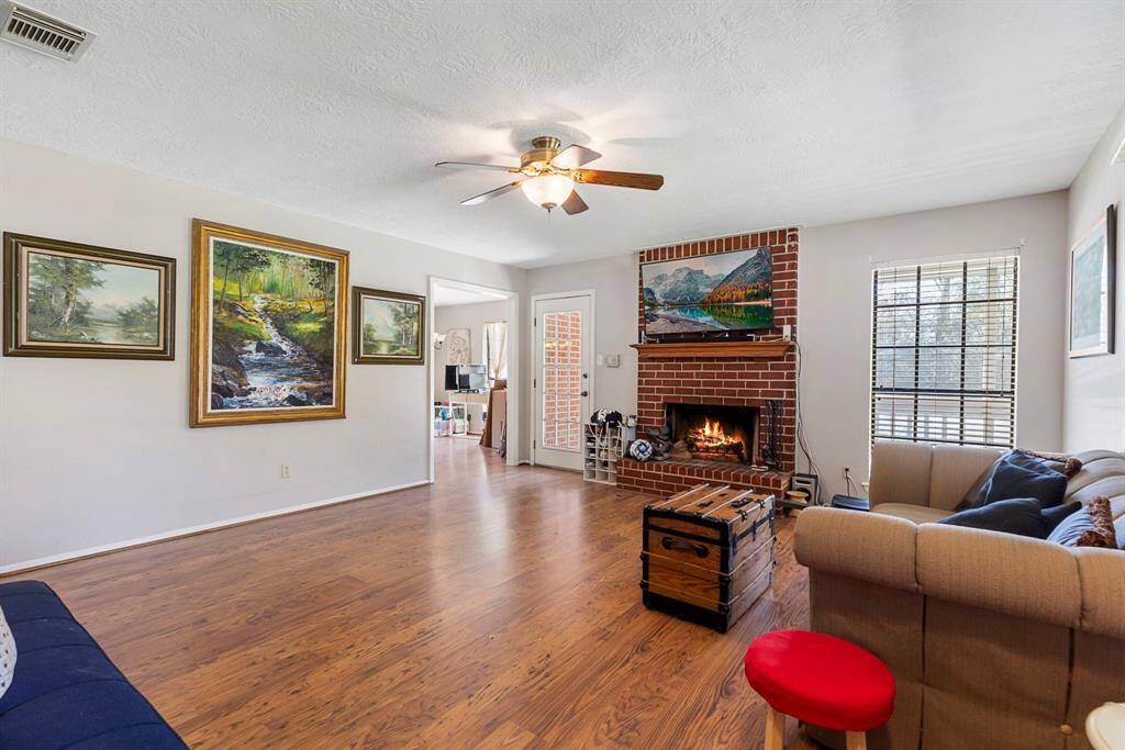 Family room features wood burning firelplace and setps from island kitchen and dining area.