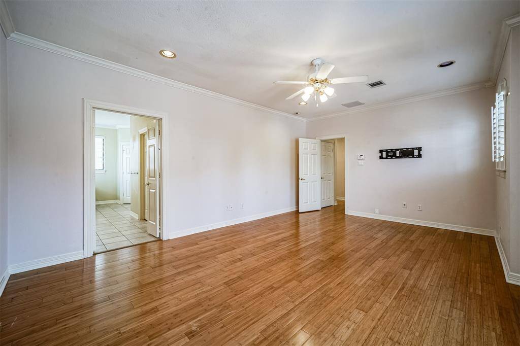 Primary bedroom offering lots of natural light and a balcony.