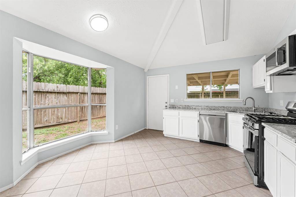 Bay window offers plenty of natural light in this undated kitchen.