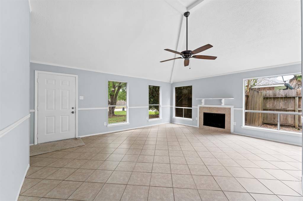 Living room and wood burning fireplace for relaxing or entertaining.