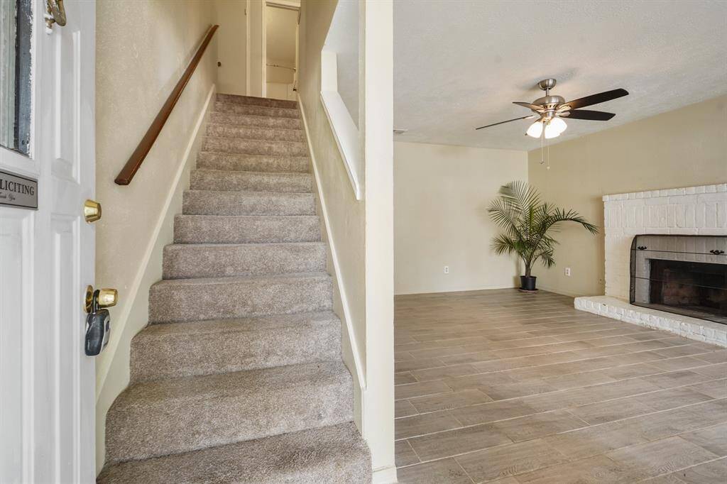 Unit 10047 has been freshly painted and features beautiful neutral tile on the 1st floor.