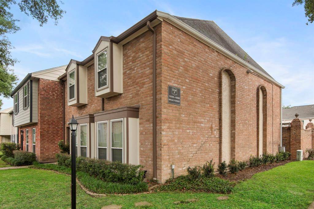 Classic brick architecture and manicured landscaping give this home a timeless, inviting feel.