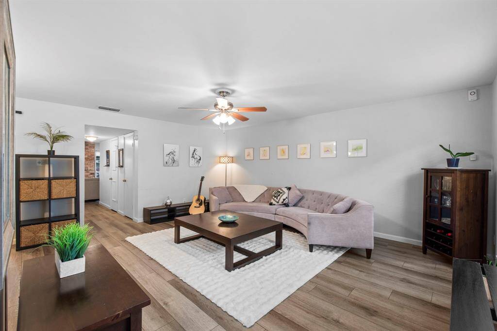 Spacious, bright, and airy with soft gray walls and waterproof luxury vinyl floors—ready for relaxing or entertaining.