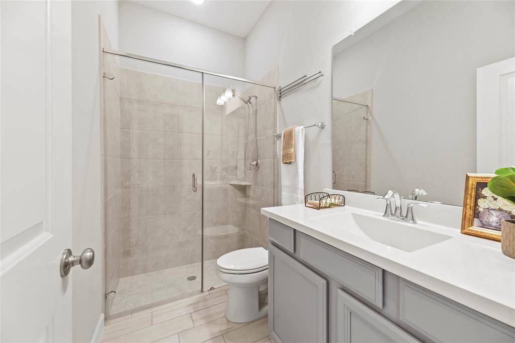 The second full bathroom found on first floor that accommodates the bedroom. It has a stand-up shower which is great for family members and re-sale.