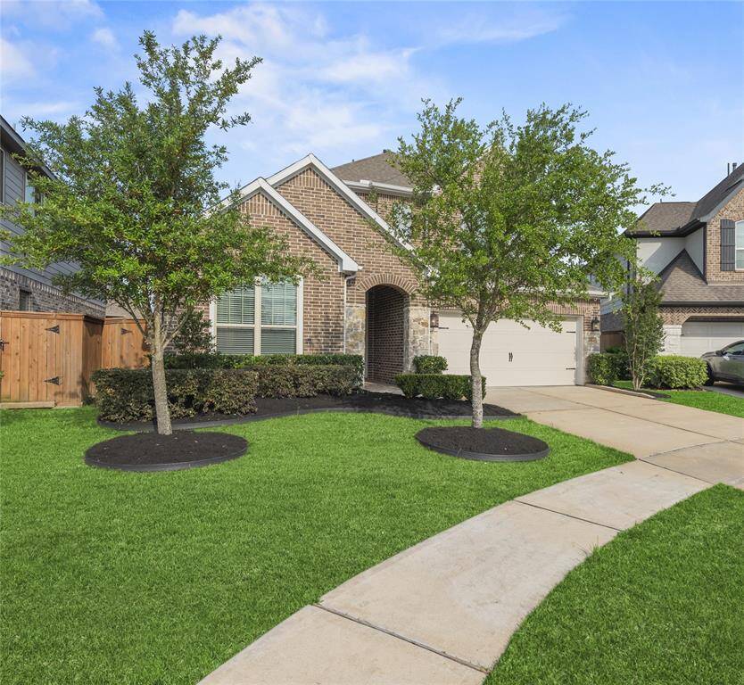 Welcome to 10919 Crestwood Point Circle! This beautiful two-story brick home features a charming exterior with stone accents and a welcoming front entrance. It includes a well-maintained lawn, a spacious two-car garage.