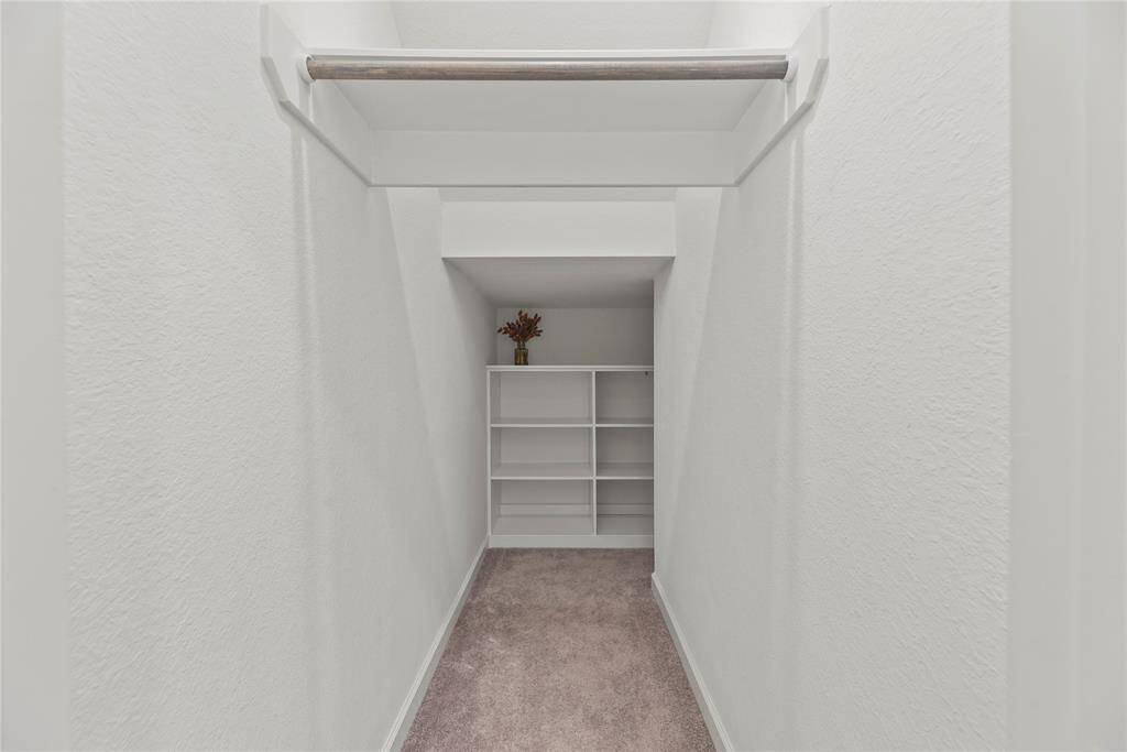 This is a great use of space under the stairs and has a built in for maximizing your storage ability.