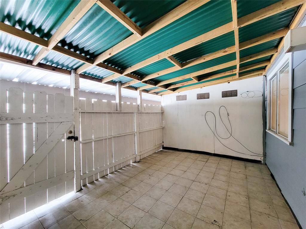 This covered back patio is a great flex space for a tenant to use as they please.