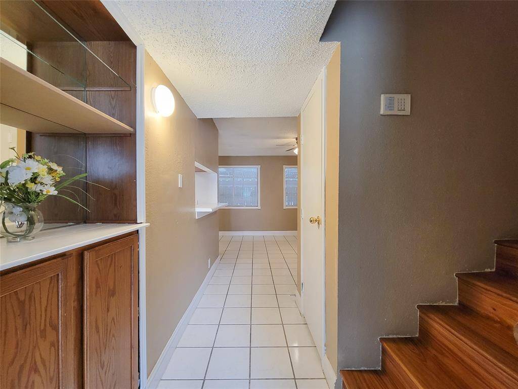 Built in storage between the living room and dining room. There is a coset under the stairs as well.