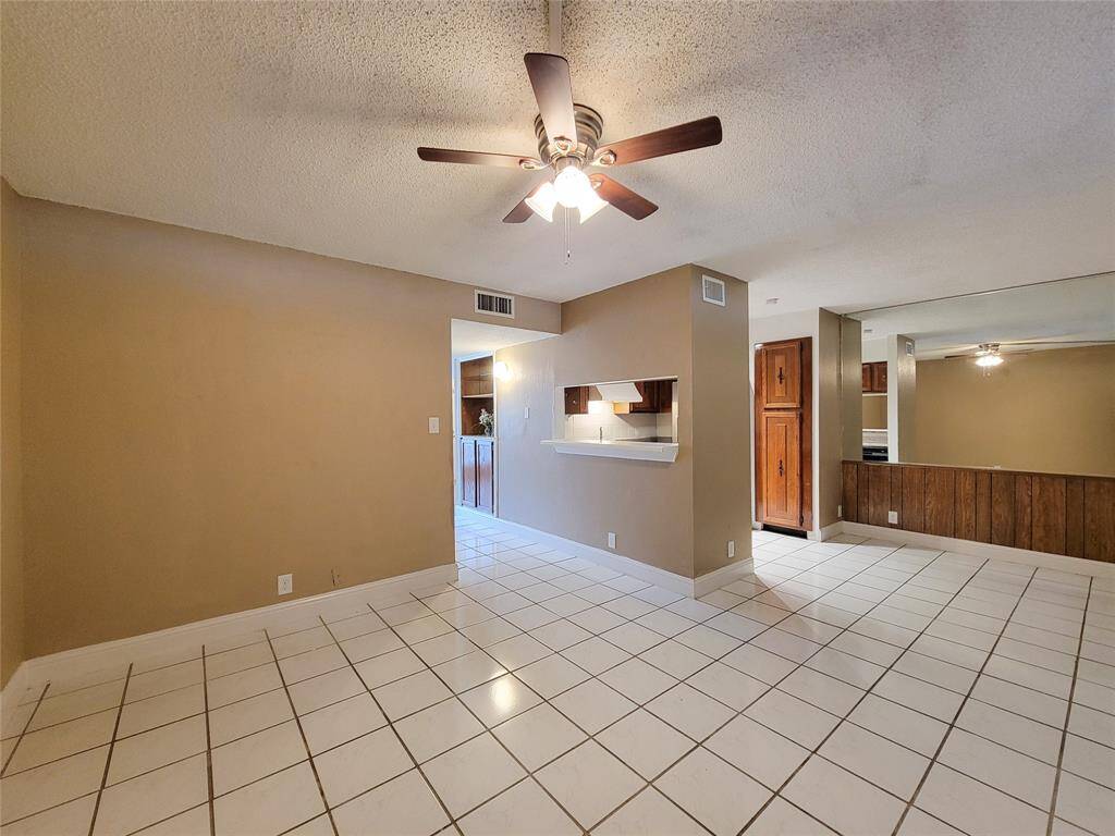 The den, dining and kitchen make up the rest of the first floor along with a utility room as you exit to the attached carport.